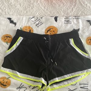 Black and lime green athletic shorts